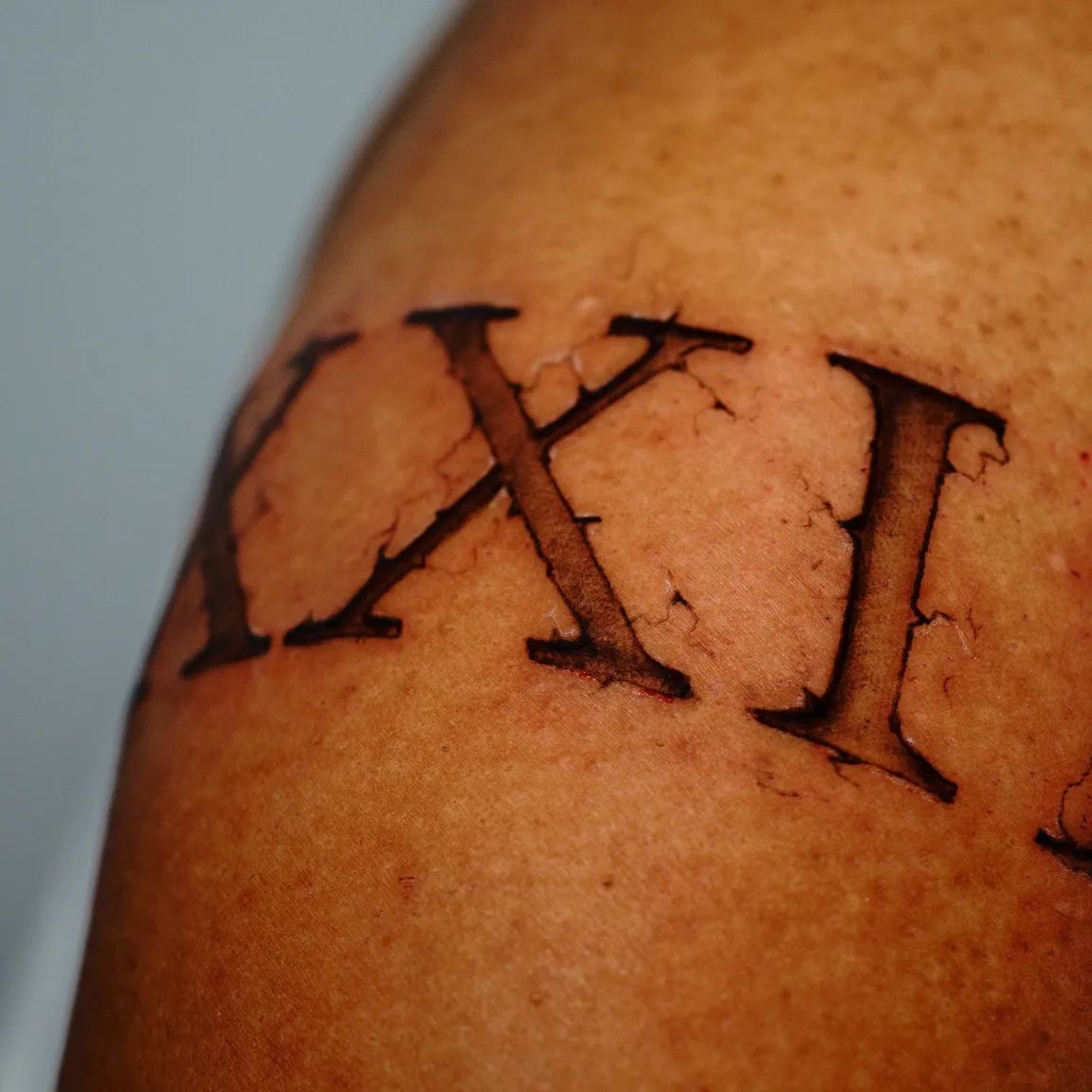 roman numerals arm band tattoo